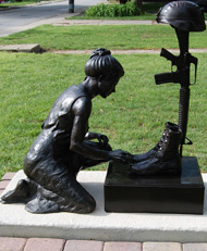 Woman Kneeling at Fallen Soldier